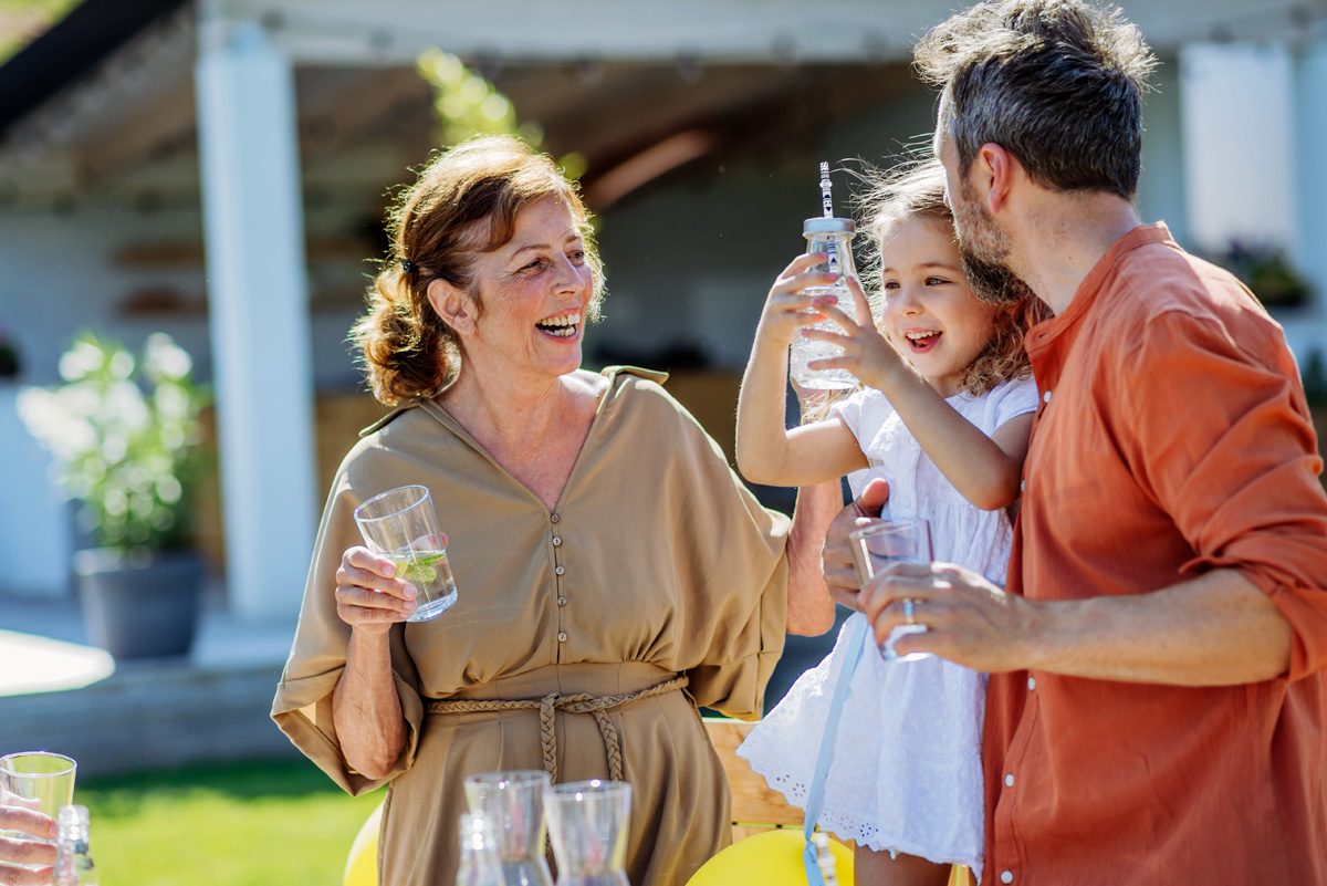 Three generations of family enjoying clean, great-tasting water together outside