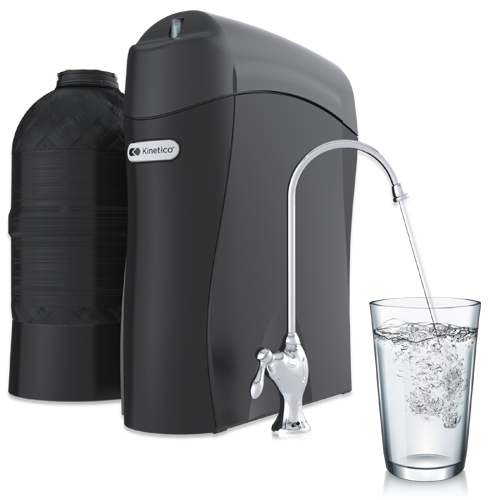 Kinetico K5 Drinking Water Station with faucet and filled glass