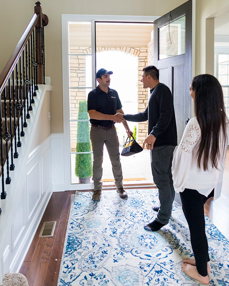 Friendly Aqua-Soft service technician arriving at home